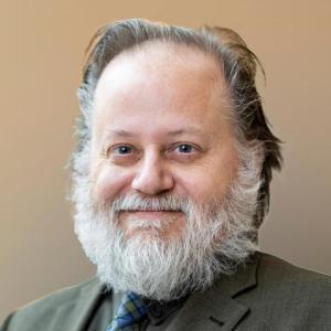 A photo of Charles Howe, PhD.