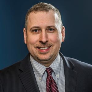 A photo of John Strang, PsyD.