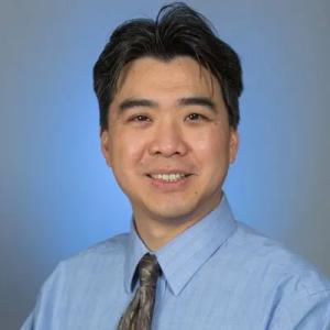 A photo of Raymond Wang, MD.