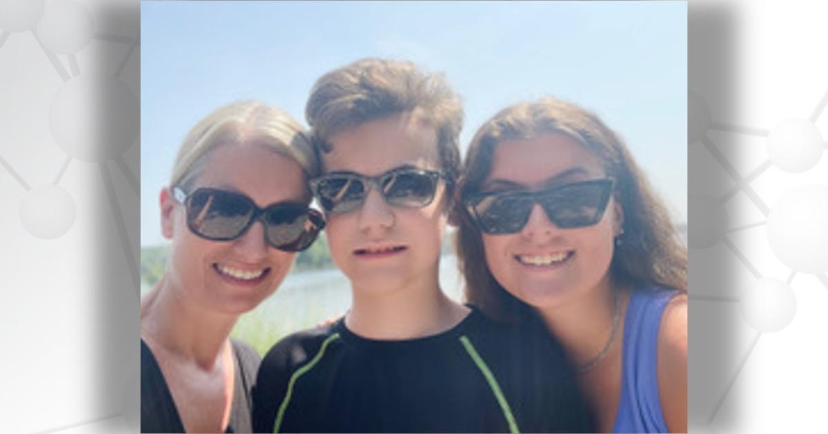 Mitchell Magyar with his mother and sister, wearing sunglasses and smiling